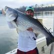 Guide Mike Walker hold big striper from 2015
